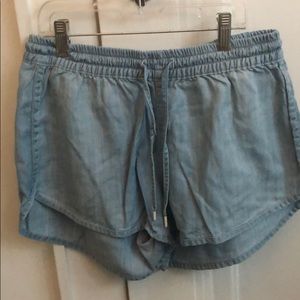 A pair of light blue shorts.